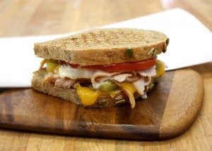 From our menu: The Green Chili Turkey Melt on our Dakota bread
